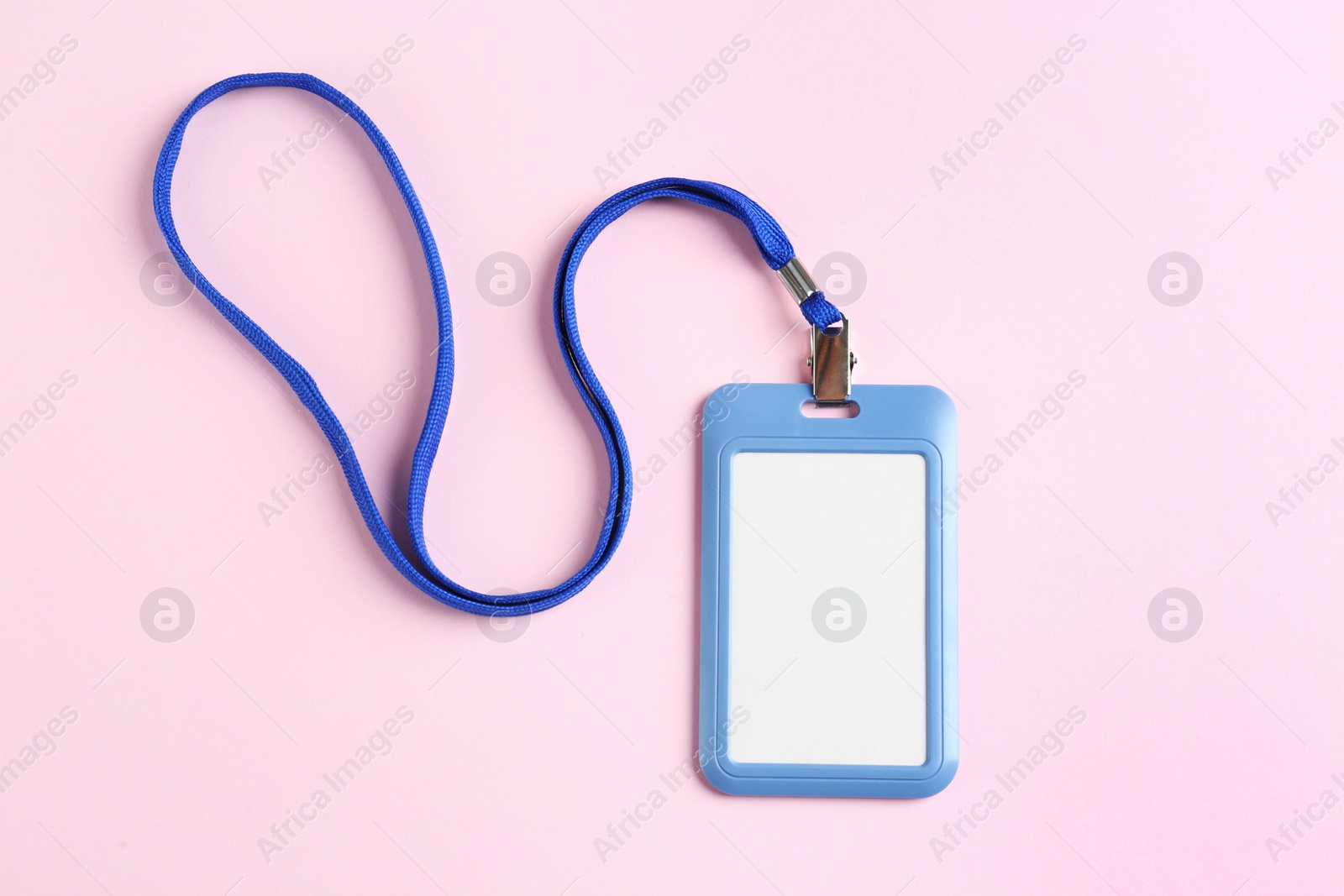 Photo of Blank badge on pink background, top view. Mockup for design