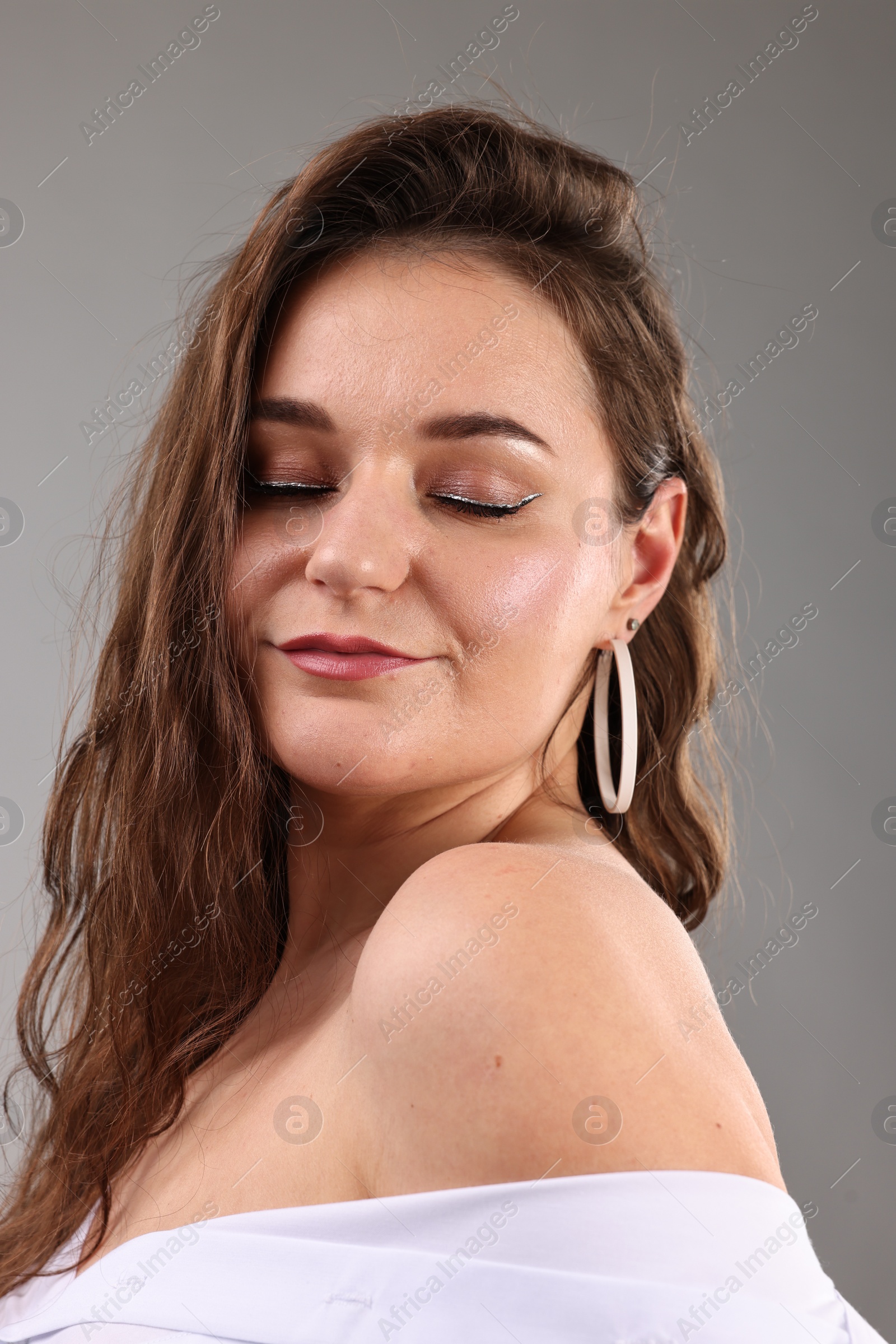 Photo of Portrait of beautiful woman on light grey background