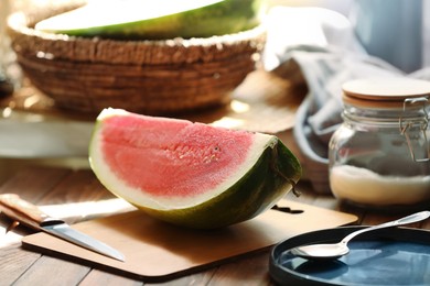 Photo of Slice of fresh juicy watermelon on wooden table