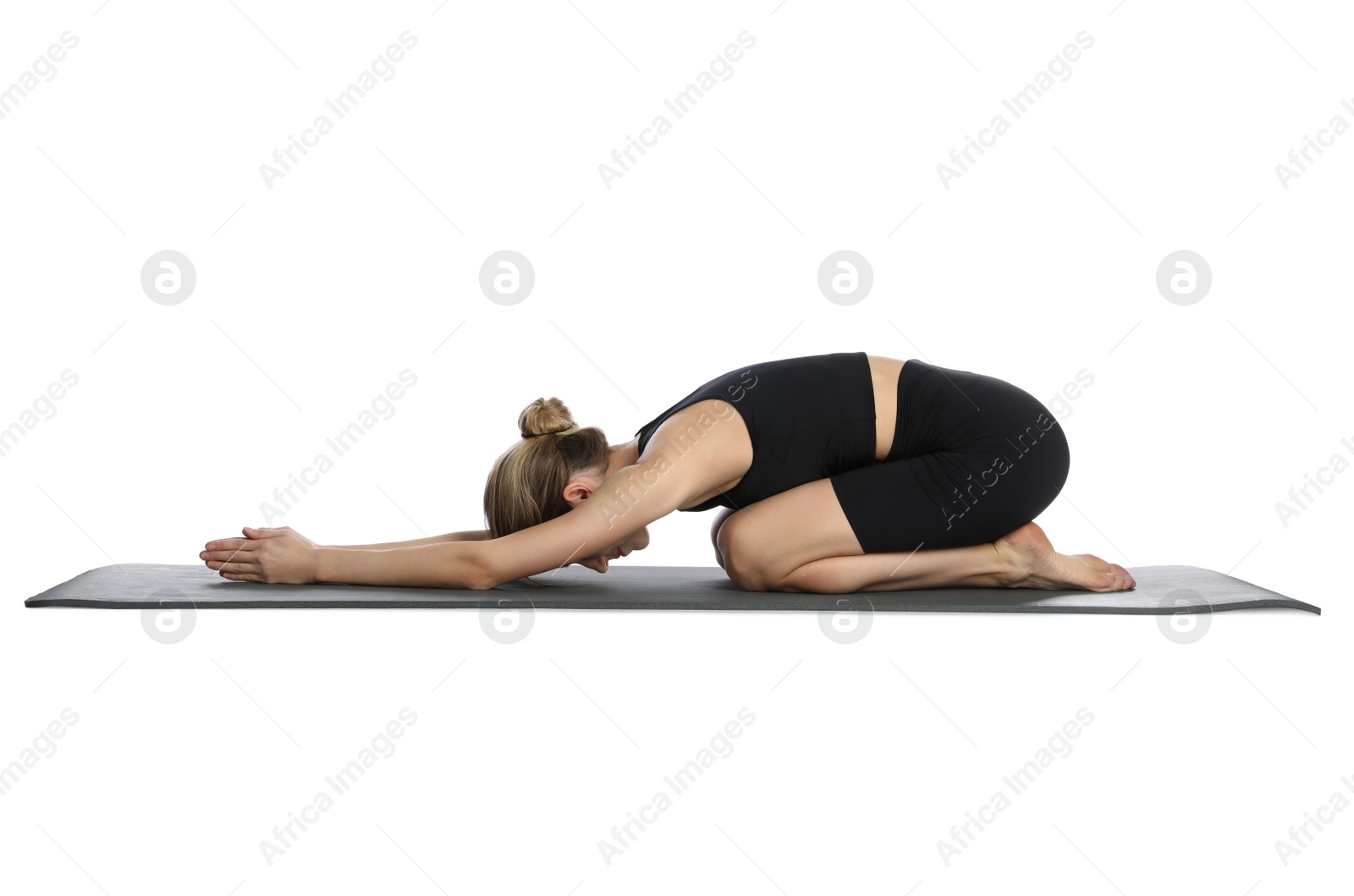 Photo of Young woman in sportswear practicing yoga on white background