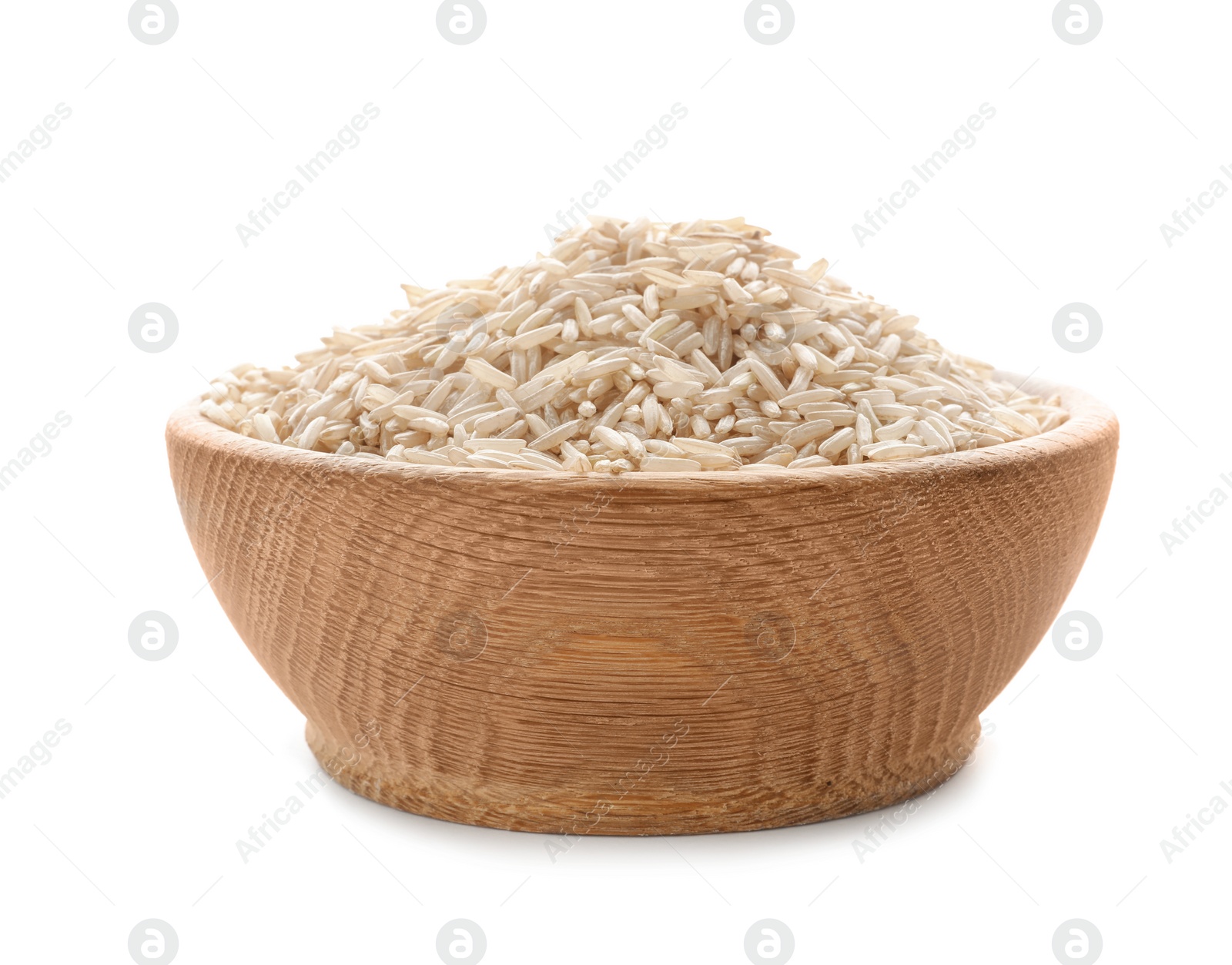 Photo of Wooden bowl with brown rice on white background