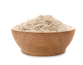 Photo of Wooden bowl with brown rice on white background