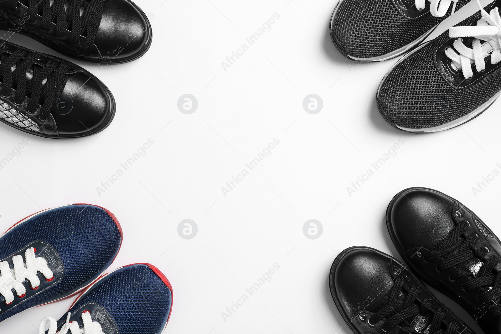 Photo of Flat lay composition of stylish shoes on white background, space for text