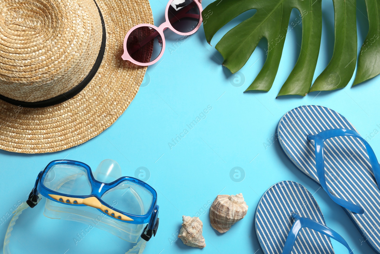 Photo of Flat lay composition with beach accessories on color background. Space for text