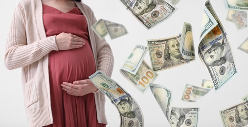 Surrogate mother under money shower on white background, closeup. Banner design