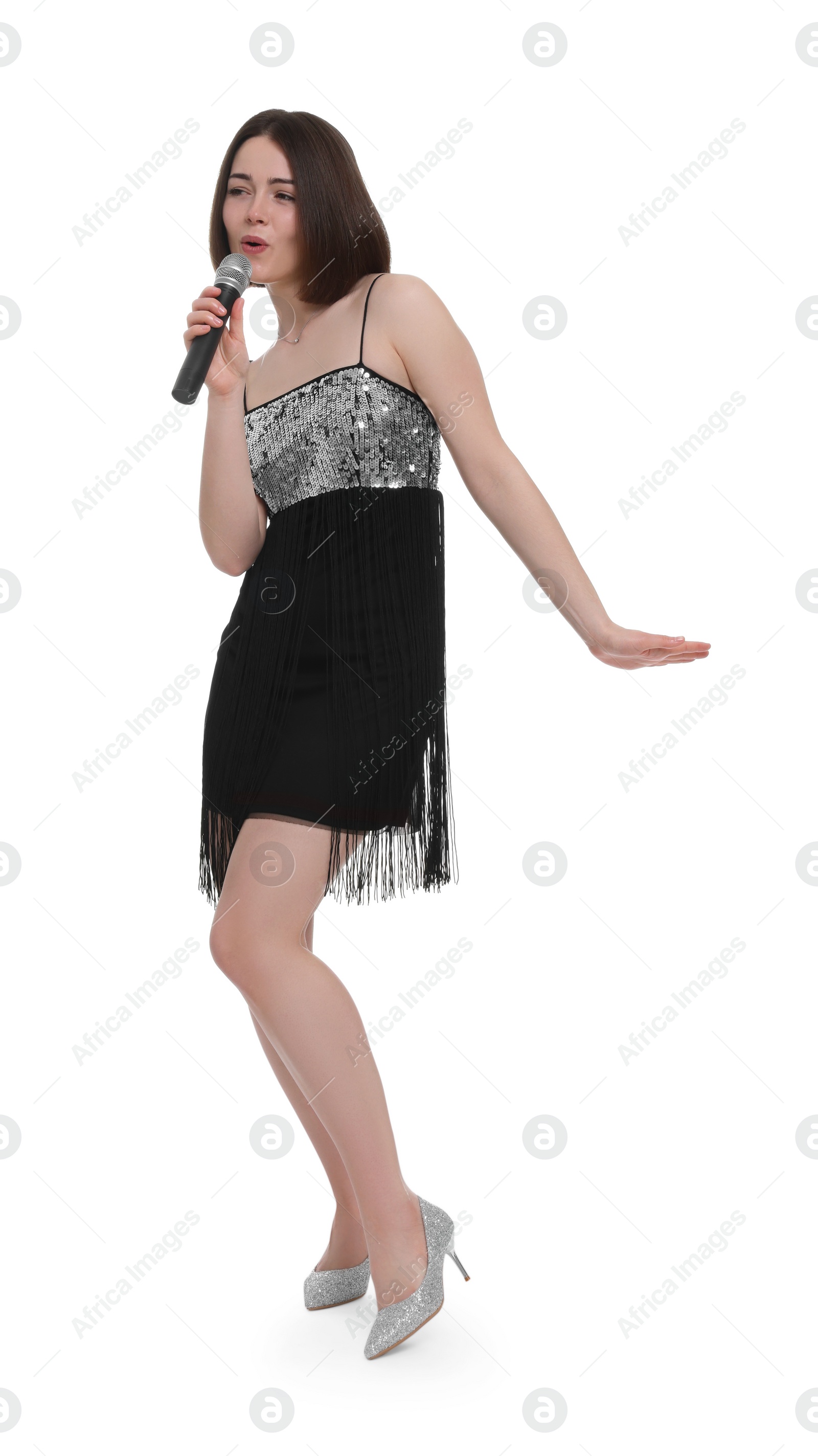 Photo of Beautiful young woman with microphone singing on white background