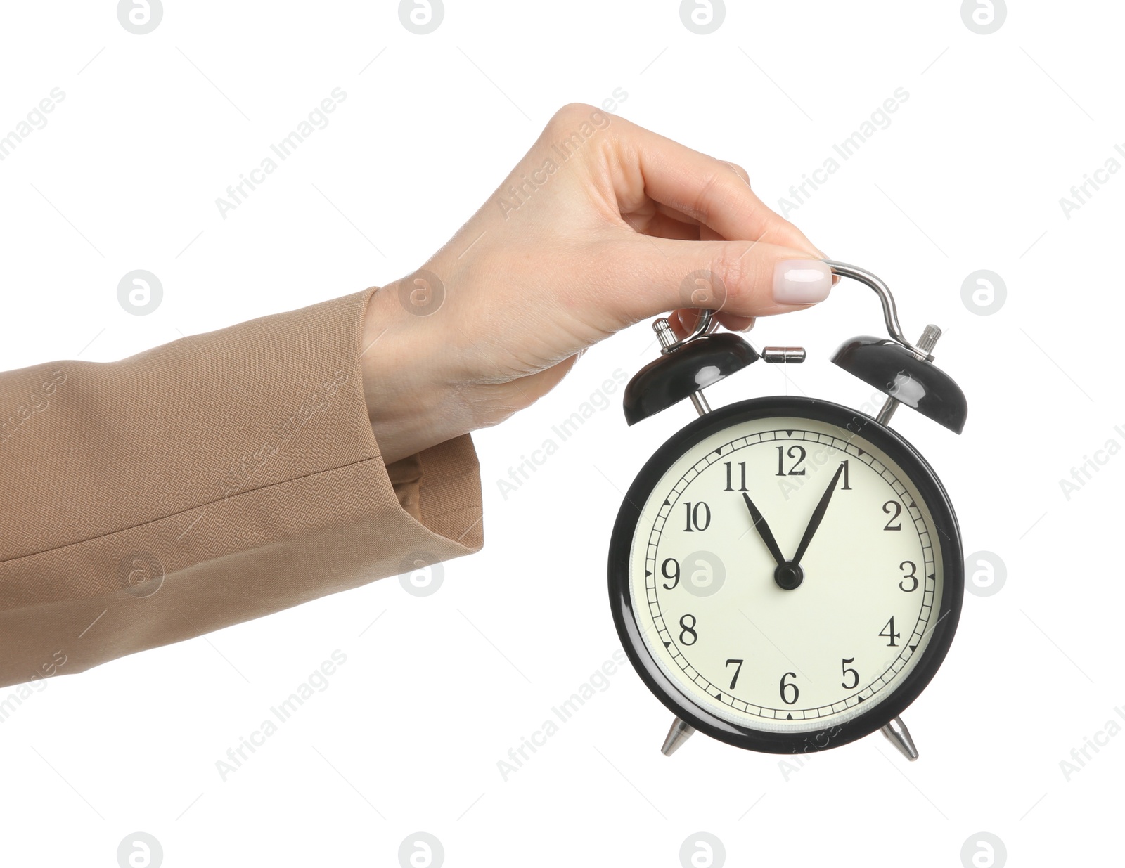 Photo of Businesswoman holding alarm clock on white background, closeup. Time management