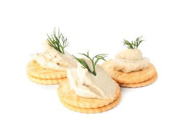 Delicious crackers with humus and dill on white background