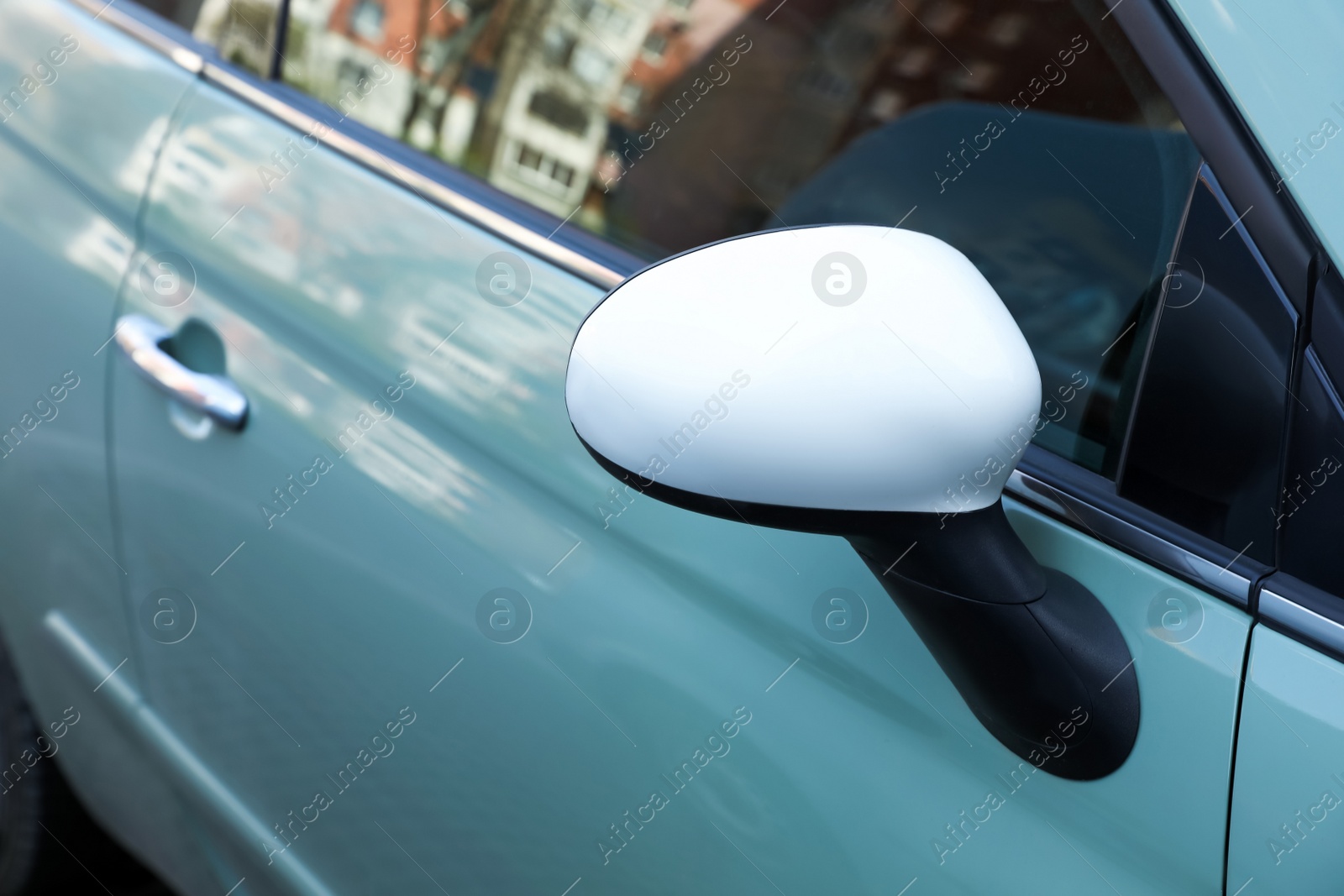 Photo of Lviv, Ukraine - May 1, 2022: Closeup view of modern light green Fiat 500