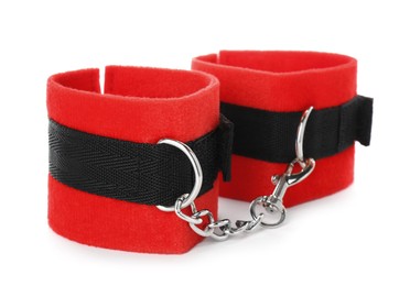 Photo of Wrist handcuffs on white background. Accessory for sexual roleplay