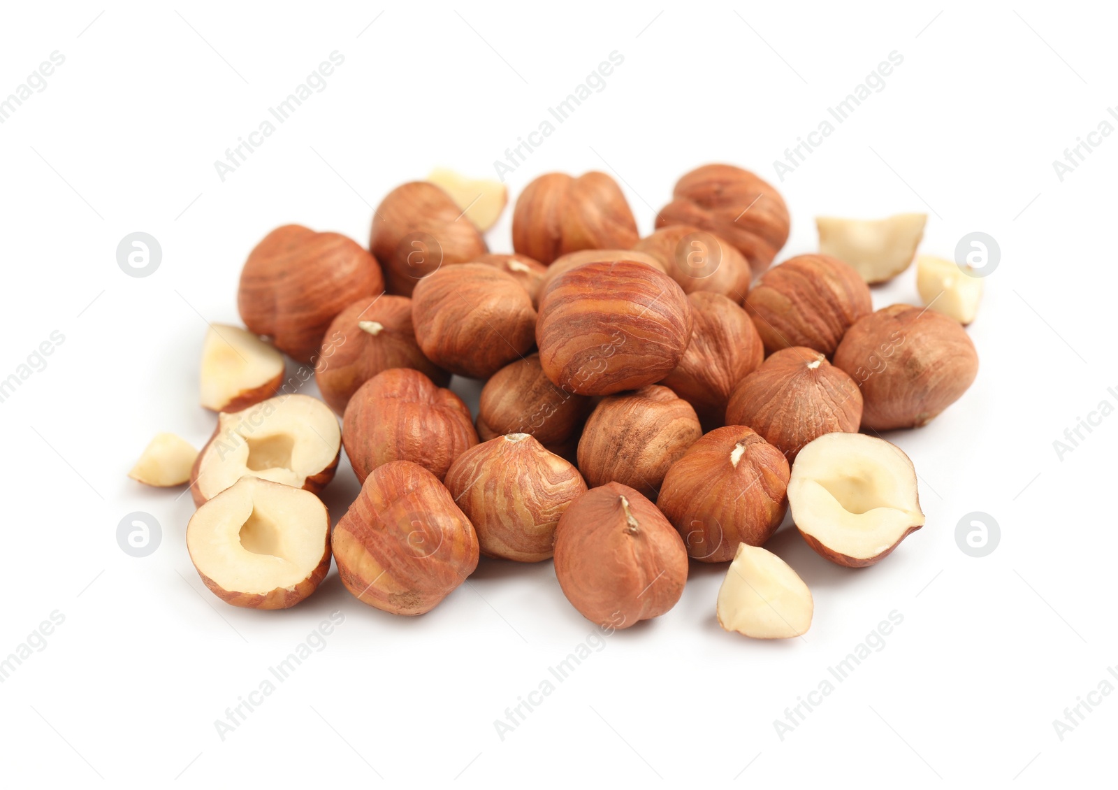 Photo of Heap of tasty hazelnuts on white background