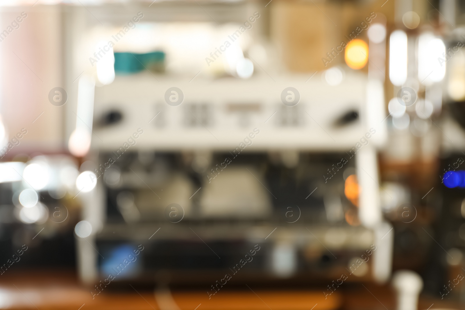 Photo of Blurred view of coffee machine on bar counter in cafe