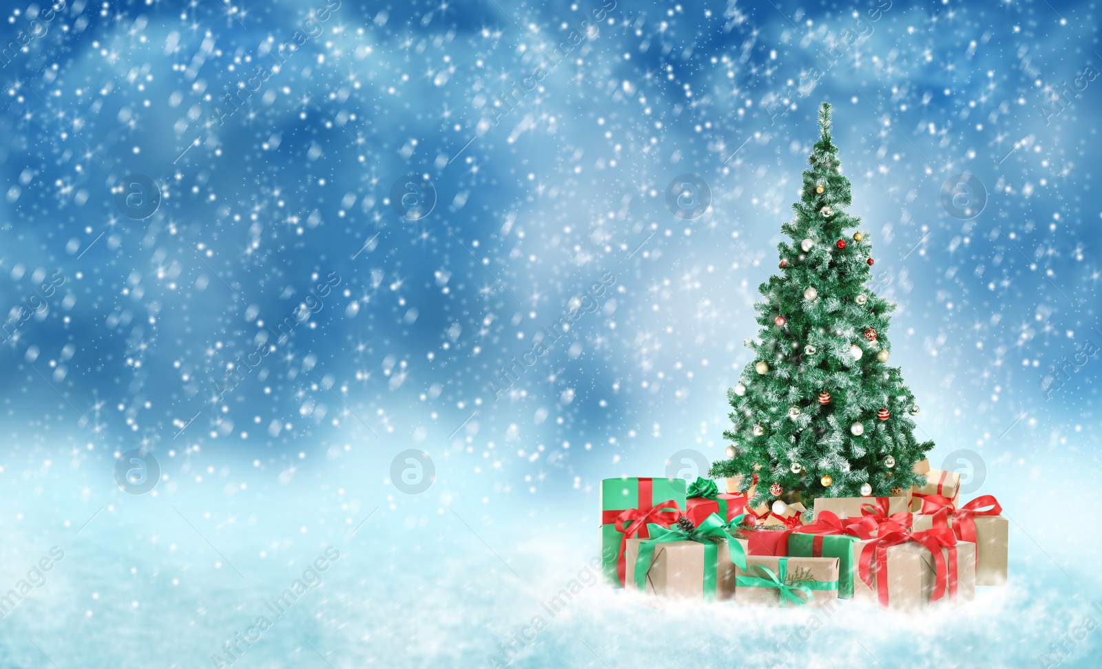 Image of Beautiful Christmas tree with gifts under snowfall, space for text