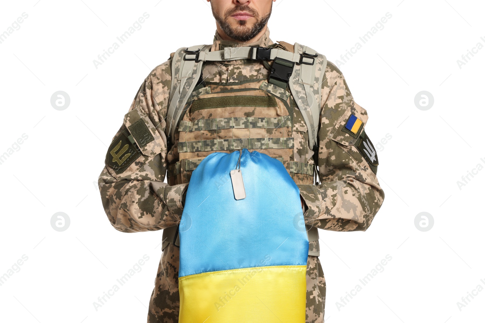 Photo of Soldier in military uniform with Ukrainian flag on white background, closeup