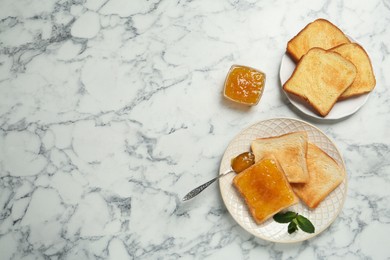 Photo of Delicious toasts with jam served on white marble table, flat lay. Space for text