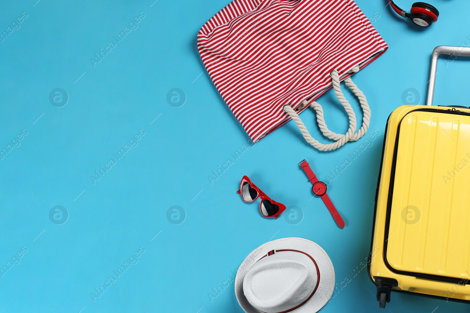 Photo of Flat lay composition with suitcase and accessories on color background, space for text. Summer vacation