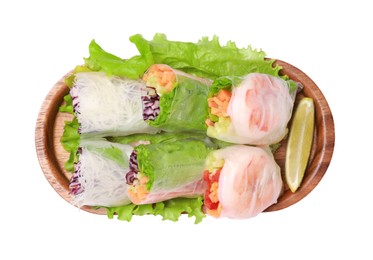 Tasty spring rolls served with lettuce and lime on white background, top view