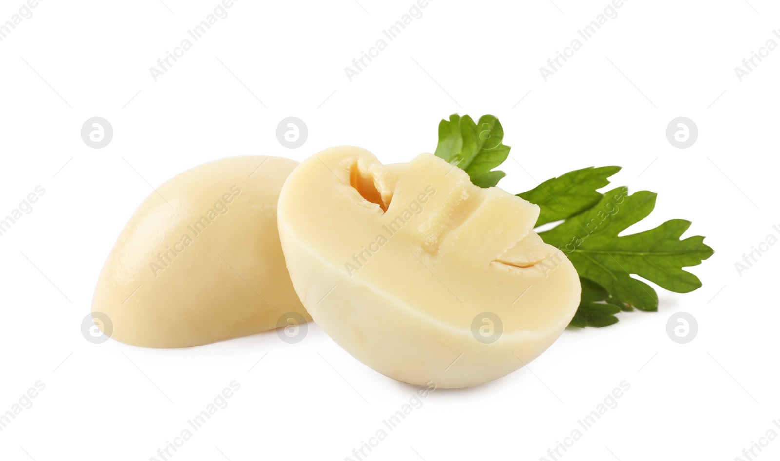 Photo of Cut marinated mushroom and parsley isolated on white