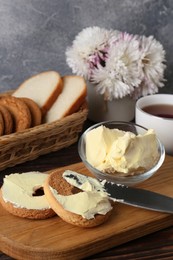 Tasty homemade butter, cookies and tea on wooden table