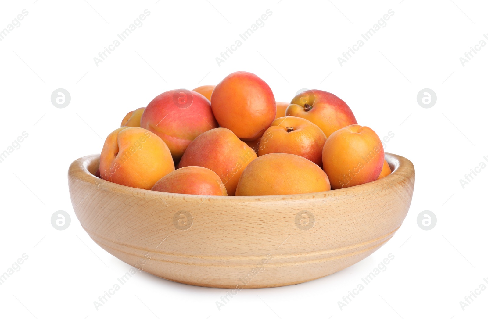 Photo of Delicious ripe apricots in wooden bowl isolated on white