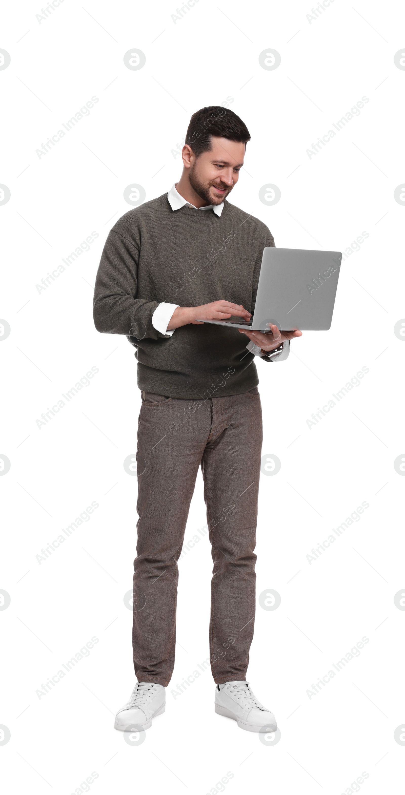 Photo of Handsome bearded businessman with laptop on white background