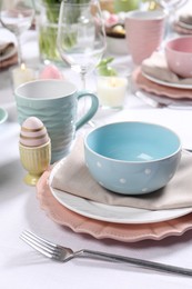 Photo of Festive table setting with elegant dishware, closeup. Easter celebration