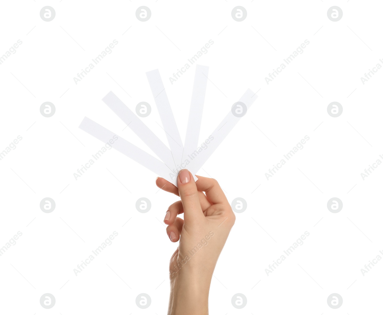 Photo of Woman holding perfume testing strips on white background, closeup