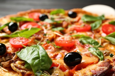 Tasty fresh homemade pizza on table, closeup