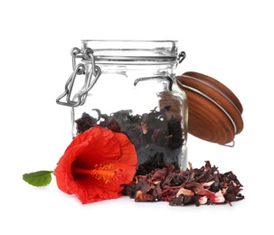 Photo of Dry hibiscus tea in glass jar and beautiful flower on white background