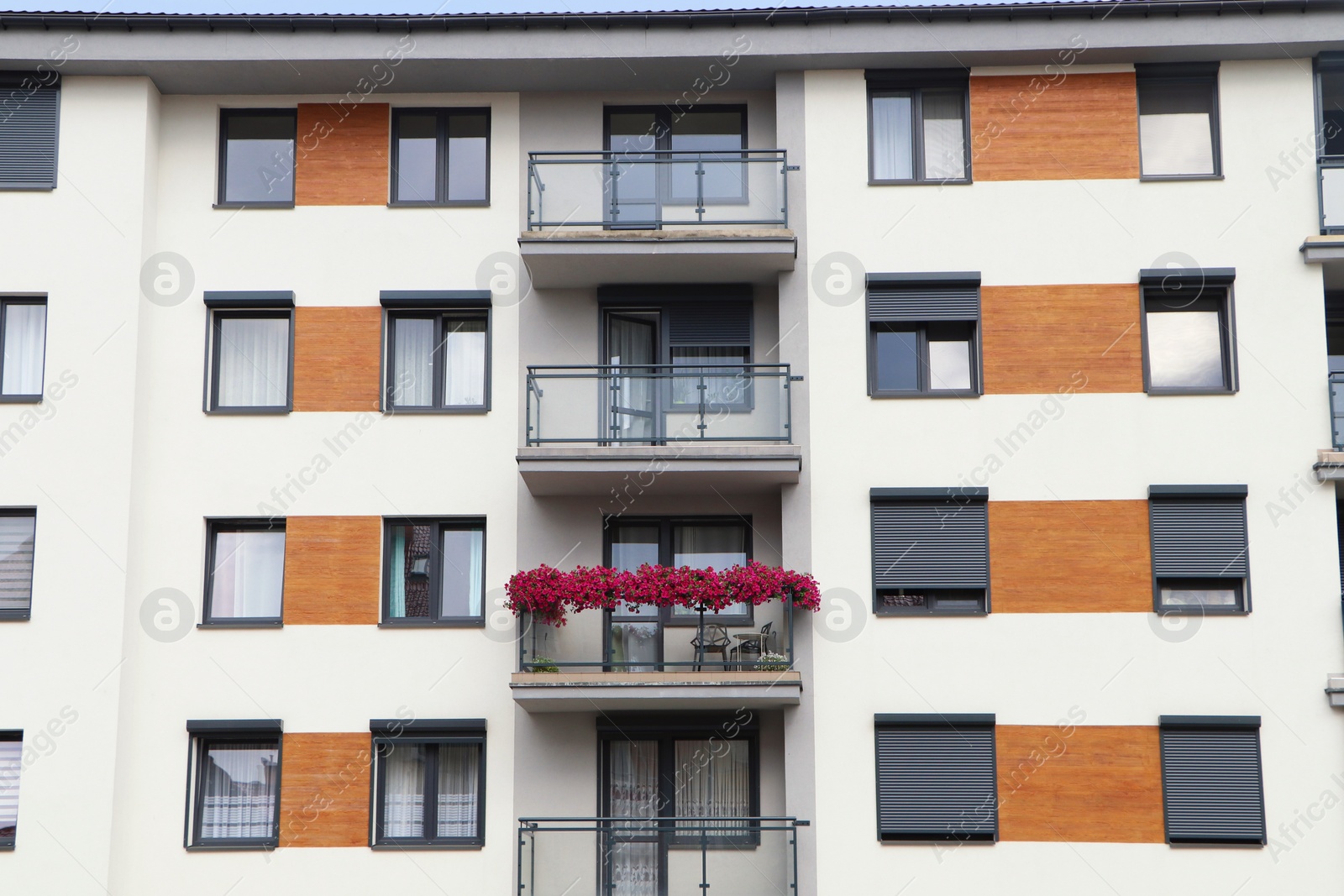 Photo of Beautiful view of building with balconies and windows