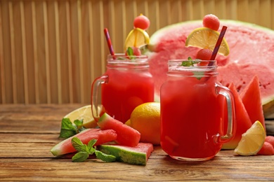 Photo of Delicious fresh watermelon drink on wooden table