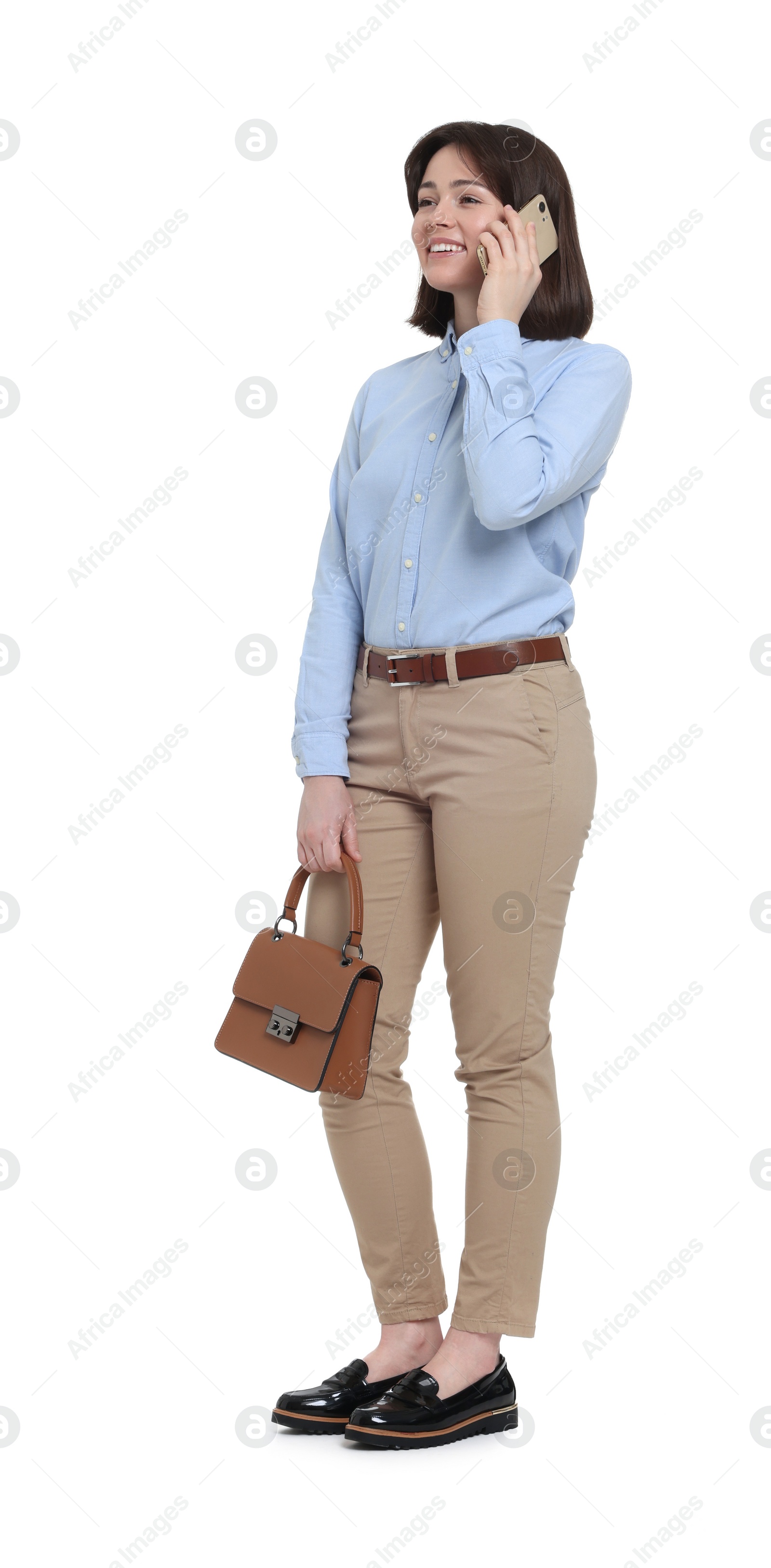 Photo of Happy woman with bag talking on smartphone against white background