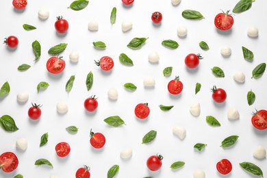 Flat lay composition with fresh ingredients for pizza on white background