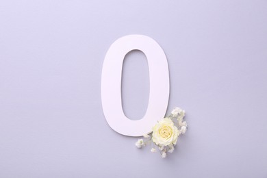 Paper number 0 and beautiful flowers on light grey background, top view