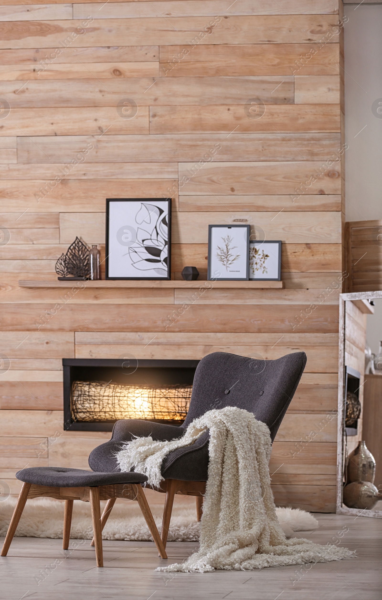 Photo of Cozy living room interior with comfortable furniture and decorative fireplace