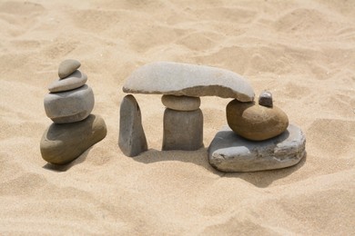 Photo of Stacks of stones on beautiful sandy beach