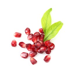 Photo of Pile of tasty pomegranate grains isolated on white, top view