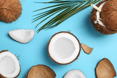 Photo of Coconut water and fresh nuts on color background