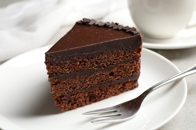 Piece of tasty chocolate cake served on plate