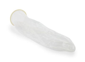 Photo of Unrolled condom on white background. Safe sex