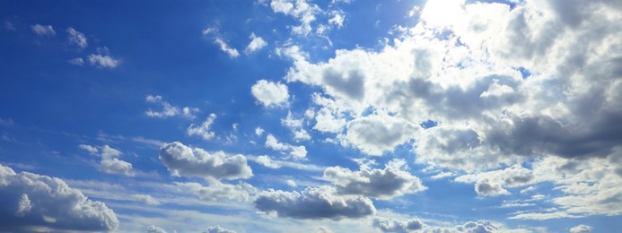 Image of Beautiful blue sky with white fluffy clouds. Banner design