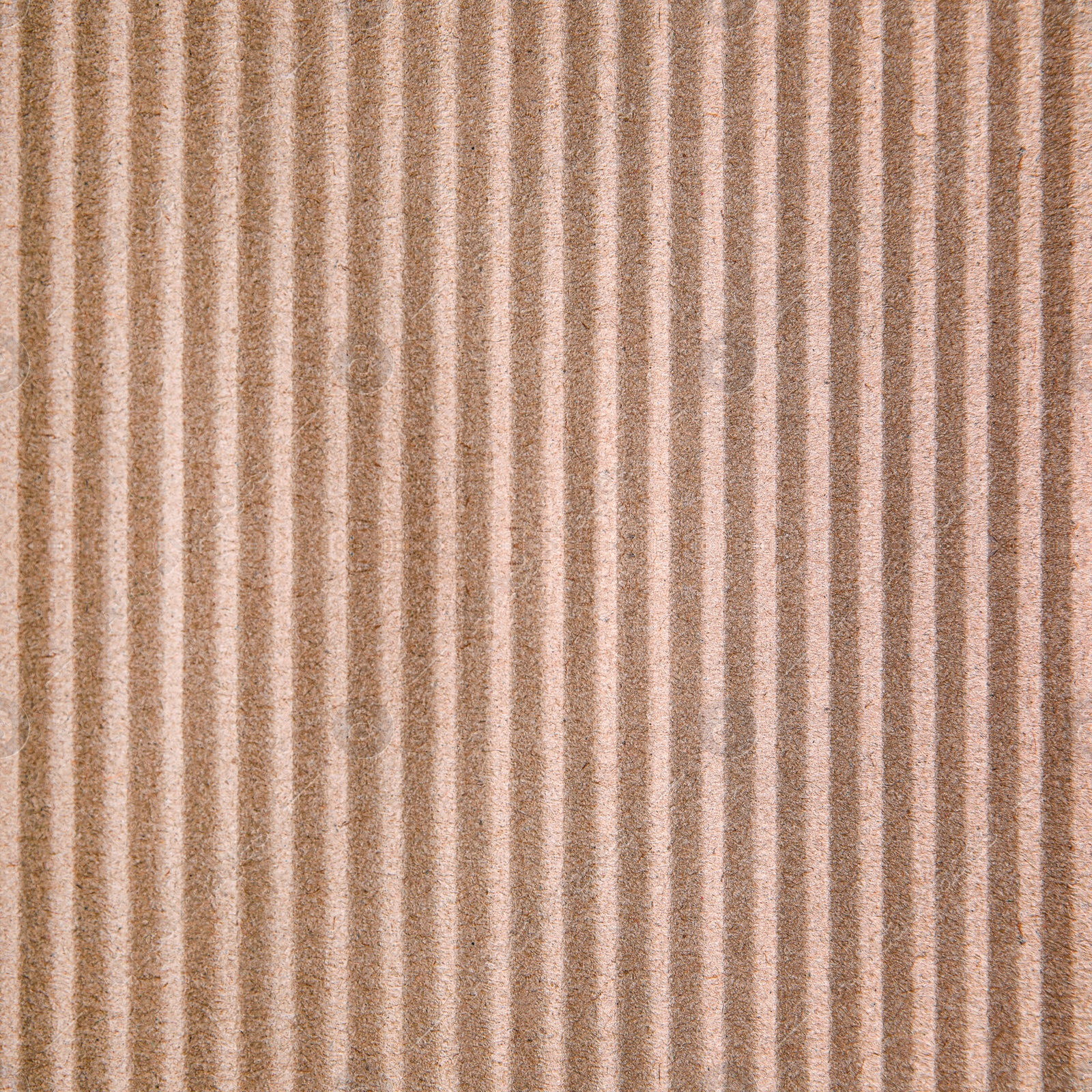 Image of Wall paper design. Brown corrugated sheet of cardboard as background