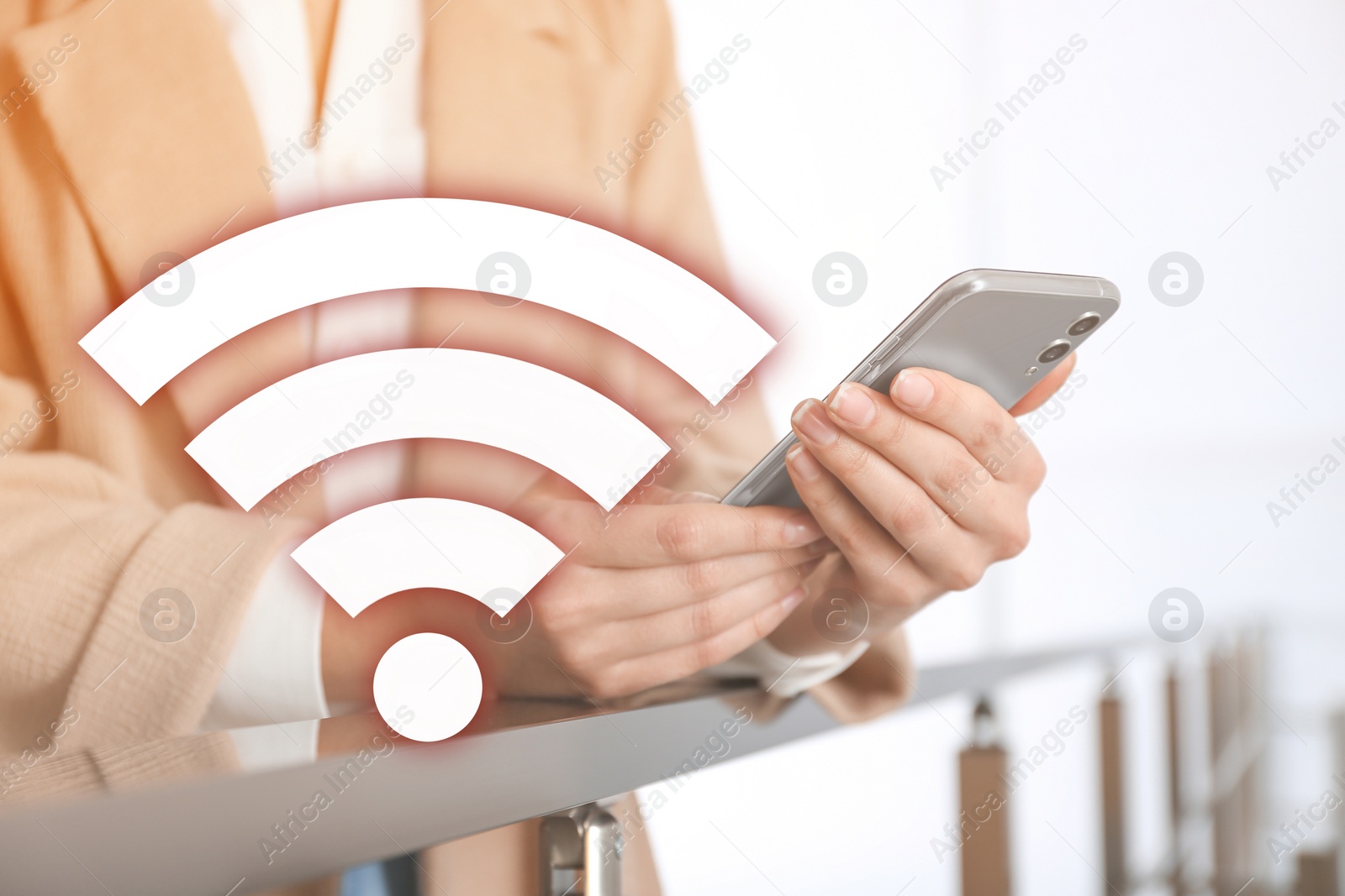 Image of Woman using smartphone connected to WiFi indoors, closeup