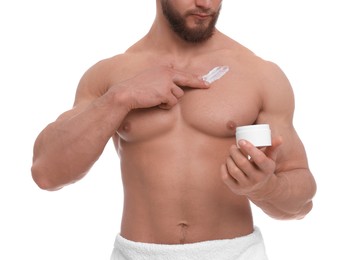Man applying body cream onto his chest on white background, closeup