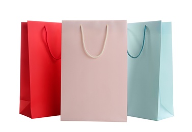 Photo of Different paper shopping bags isolated on white