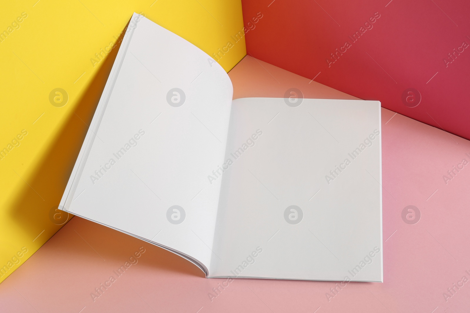 Photo of Empty book pages on color background. Mockup for design