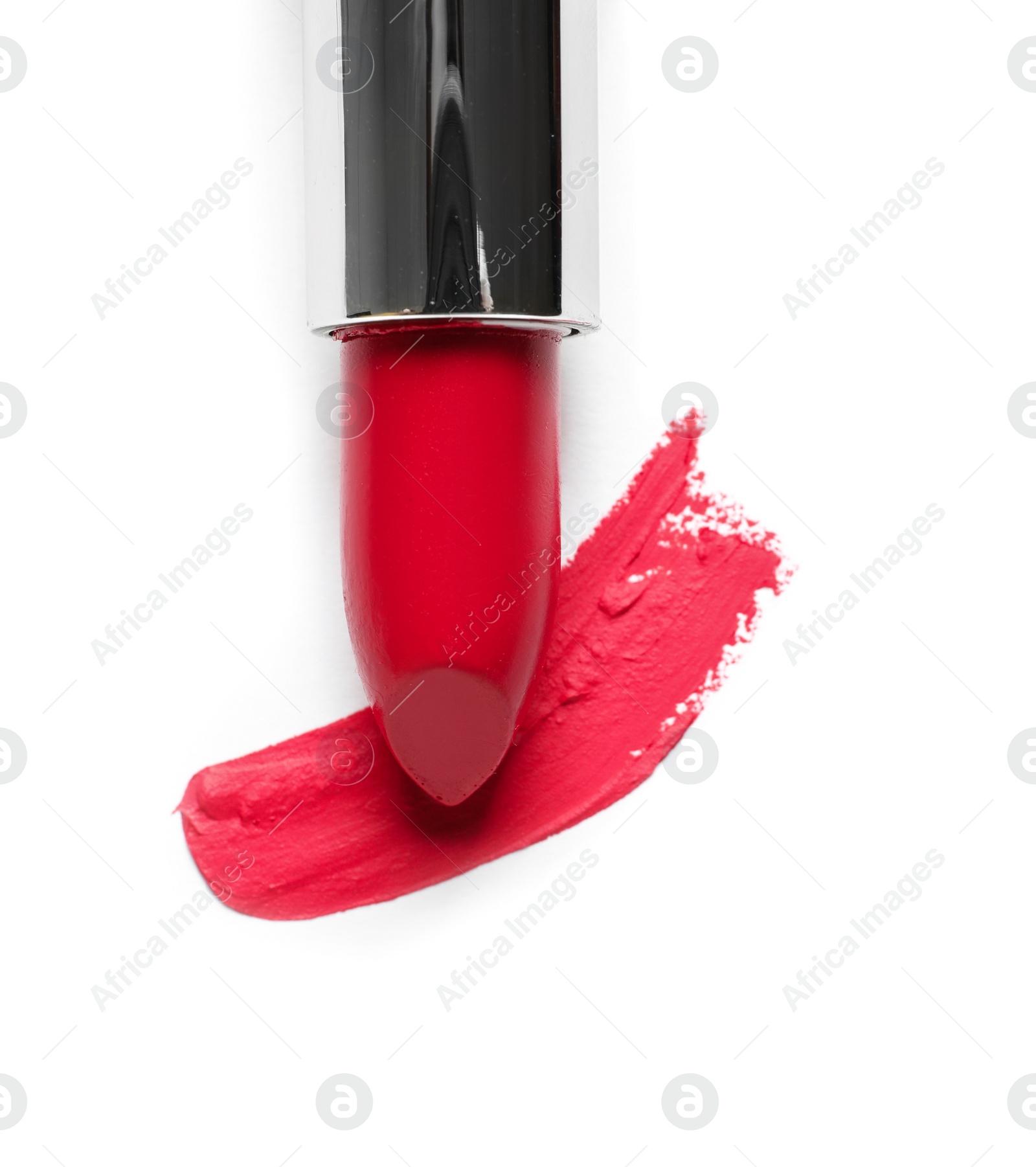 Photo of Tube of lipstick and smear isolated on white, top view