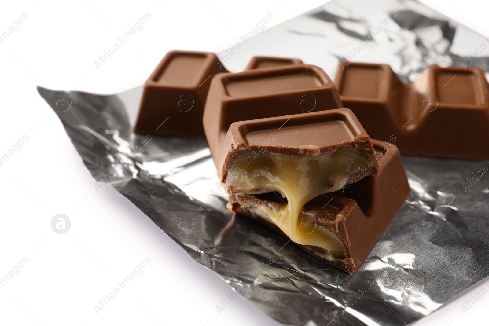 Photo of Delicious sweet chocolate bars on white background, closeup