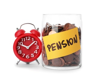 Coins in glass jar with label "PENSION" and alarm clock on white background