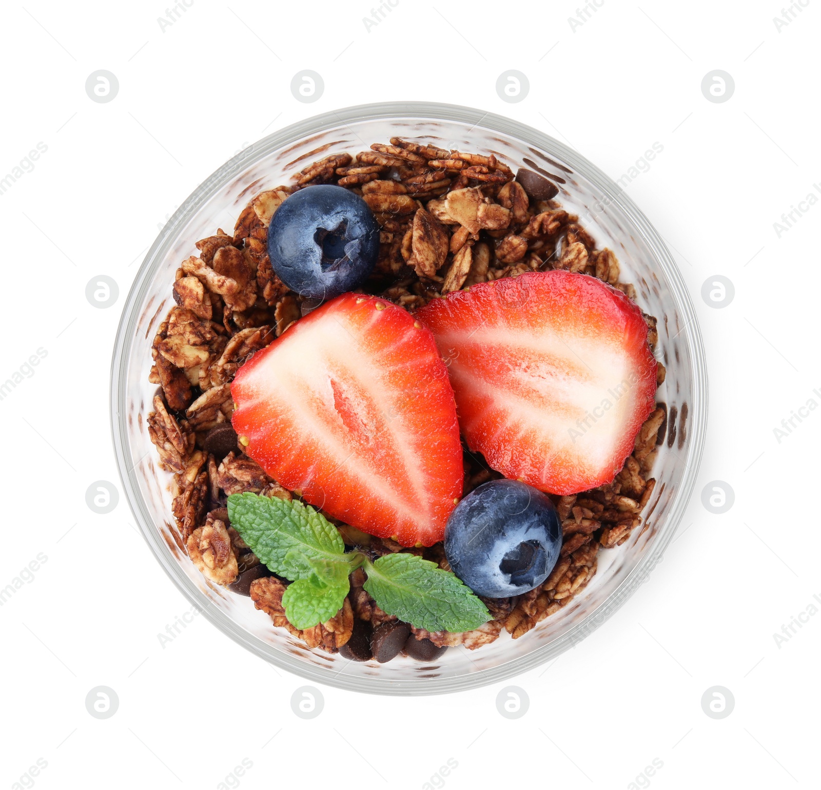 Photo of Tasty granola with berries and mint in glass isolated on white, top view